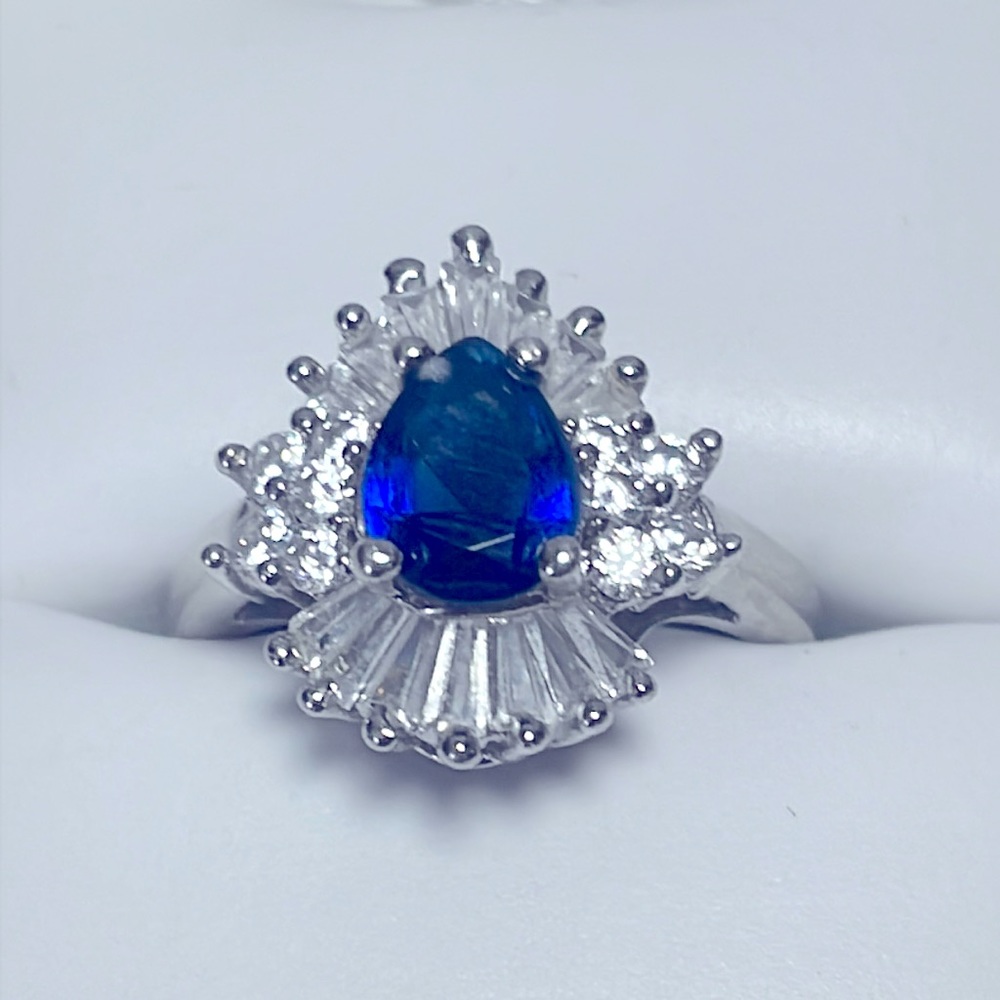 Lab Created Pear Cut Sapphire w/ White Topaz Accent in Sterling Silver